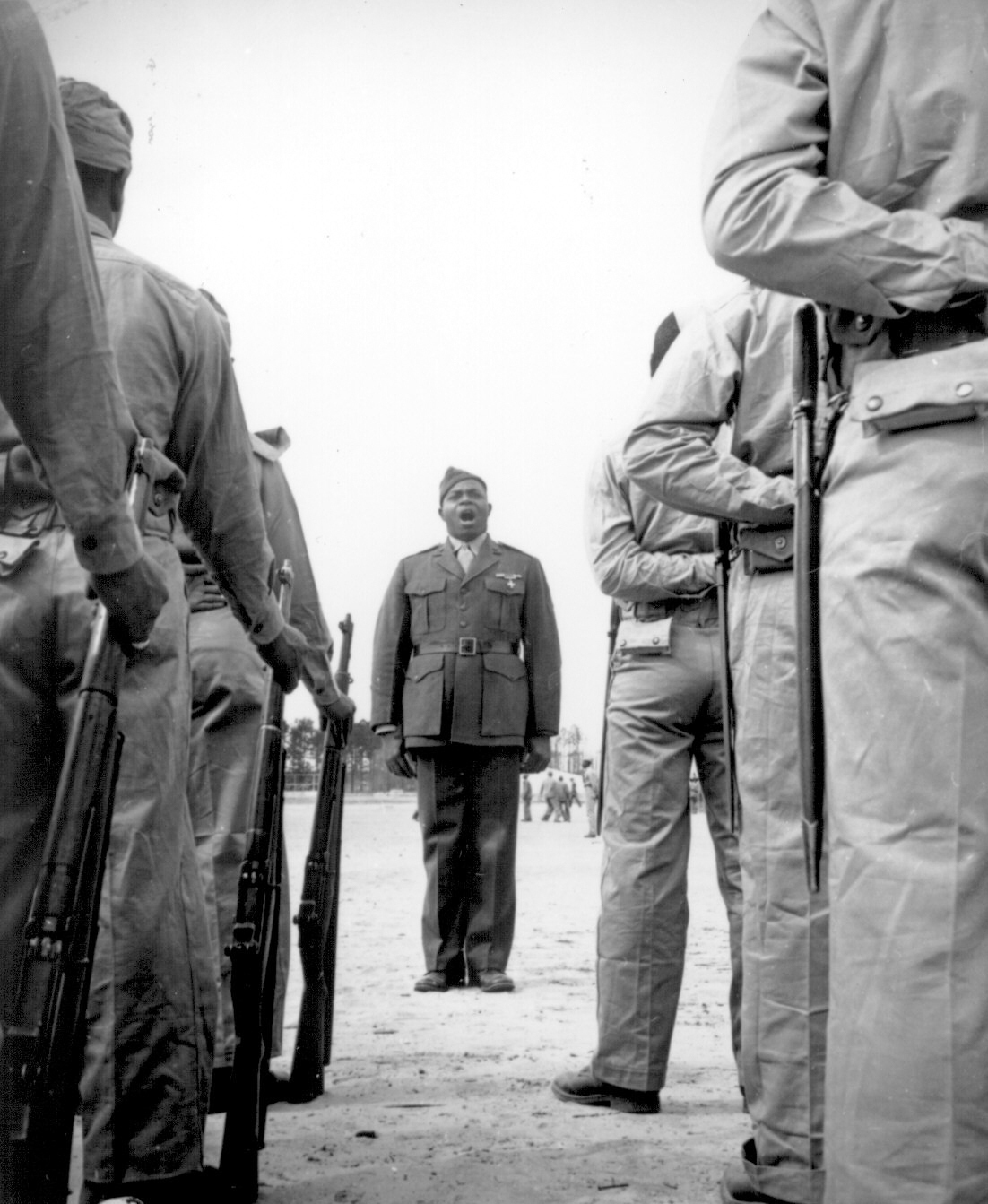 A platoon of black &quot;boot recruits&quot; listen to their drill instructor