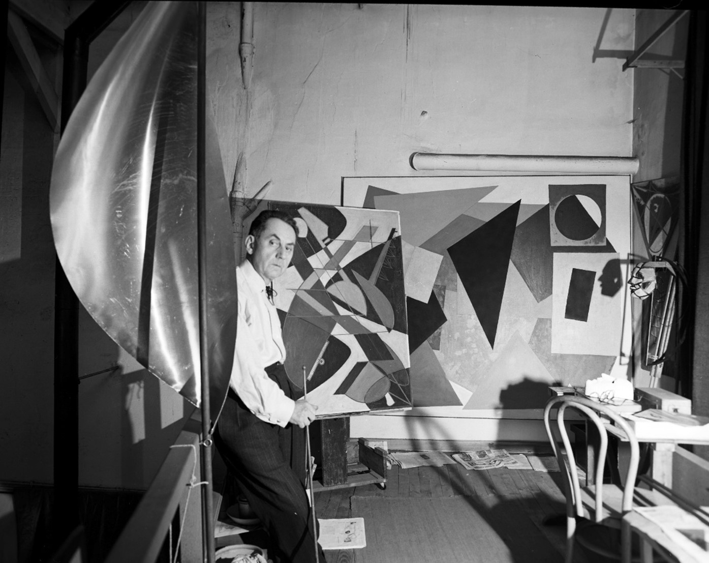 Man Ray in his studio in Paris.