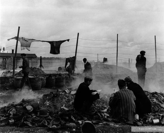 Freed prisoners at Dachau scavenging in the dump.