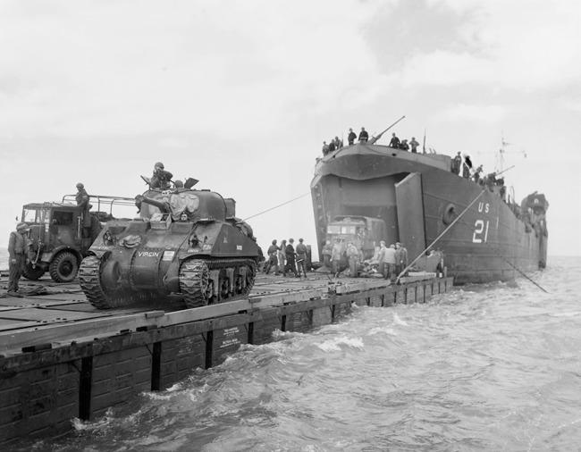 Coast Guard-manned USS LST-21 unloads British Army tanks and trucks