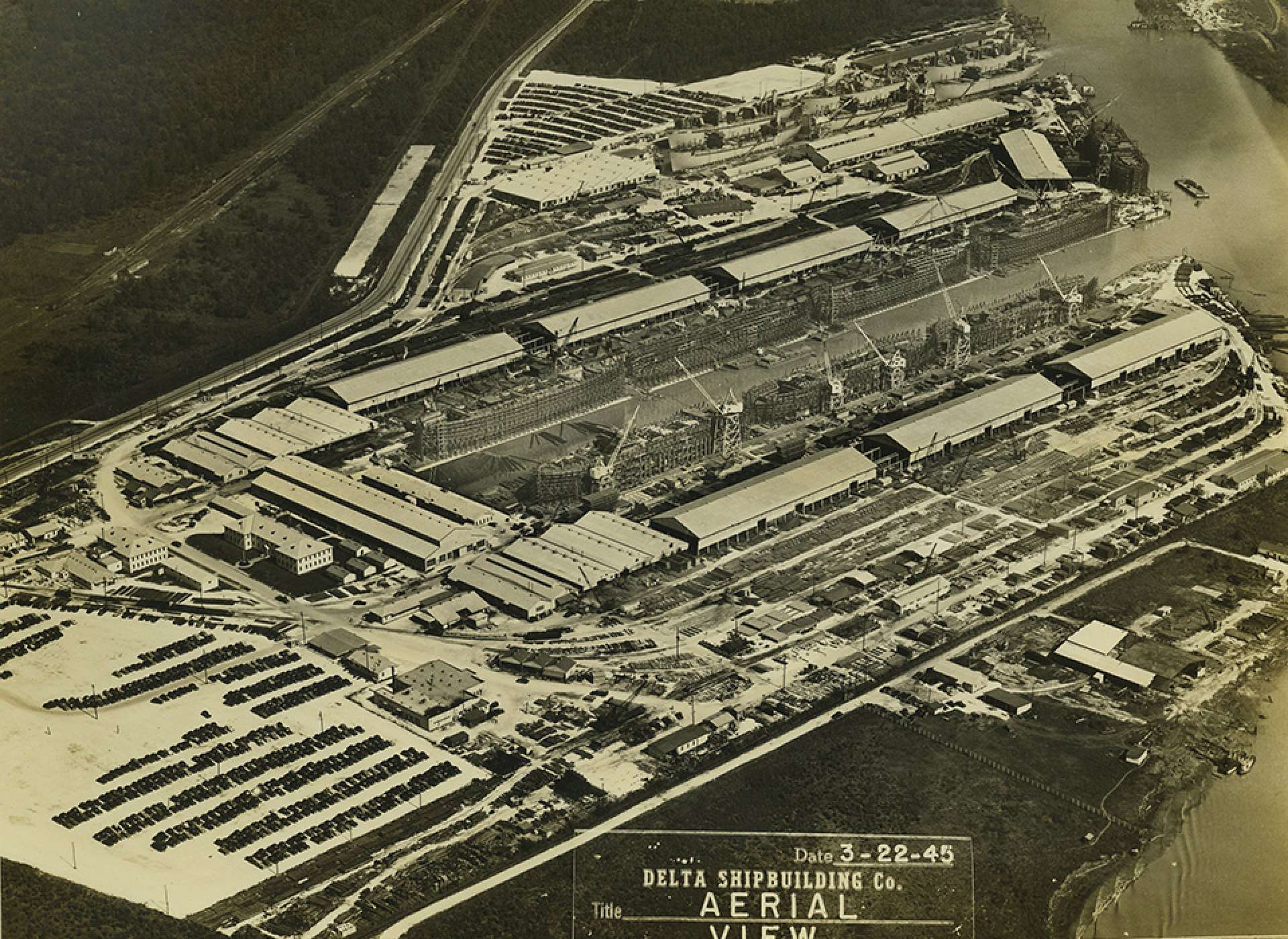 Aerial view of Delta Shipbuilding with Liberty ships under construction