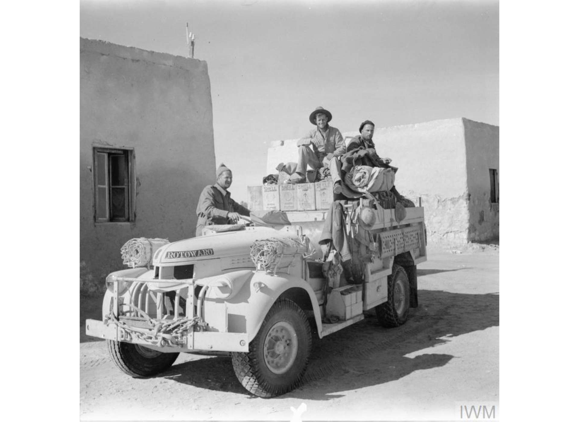 A Chevrolet truck setting off on patrol from Siwa. This was a New Zealand patrol many of whom joined the Long Range Desert Group in 1940 from troops who found themselves at Alexandria without their arms and equipment, which had been lost at sea. Note the word Rotowaro on the bonnet of the truck.  Rotowaro was a small mining village in the northern island of New Zealand.
