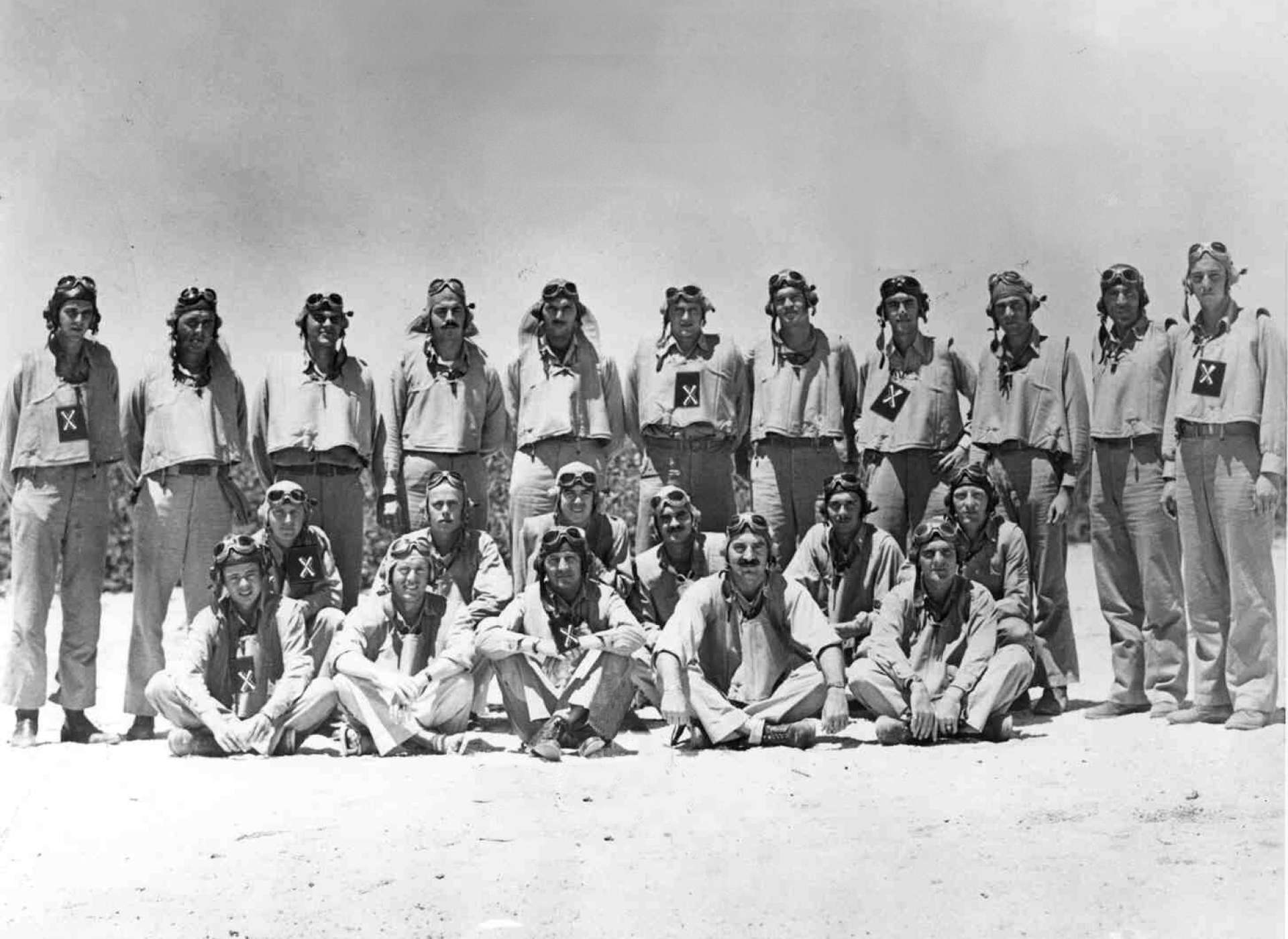 VMSB-241 pilots at Midway. Capt. Fleming is in the top row, fourth from right. Those marked with an “x” were killed during the Battle at Midway. Official U.S. Navy photograph.