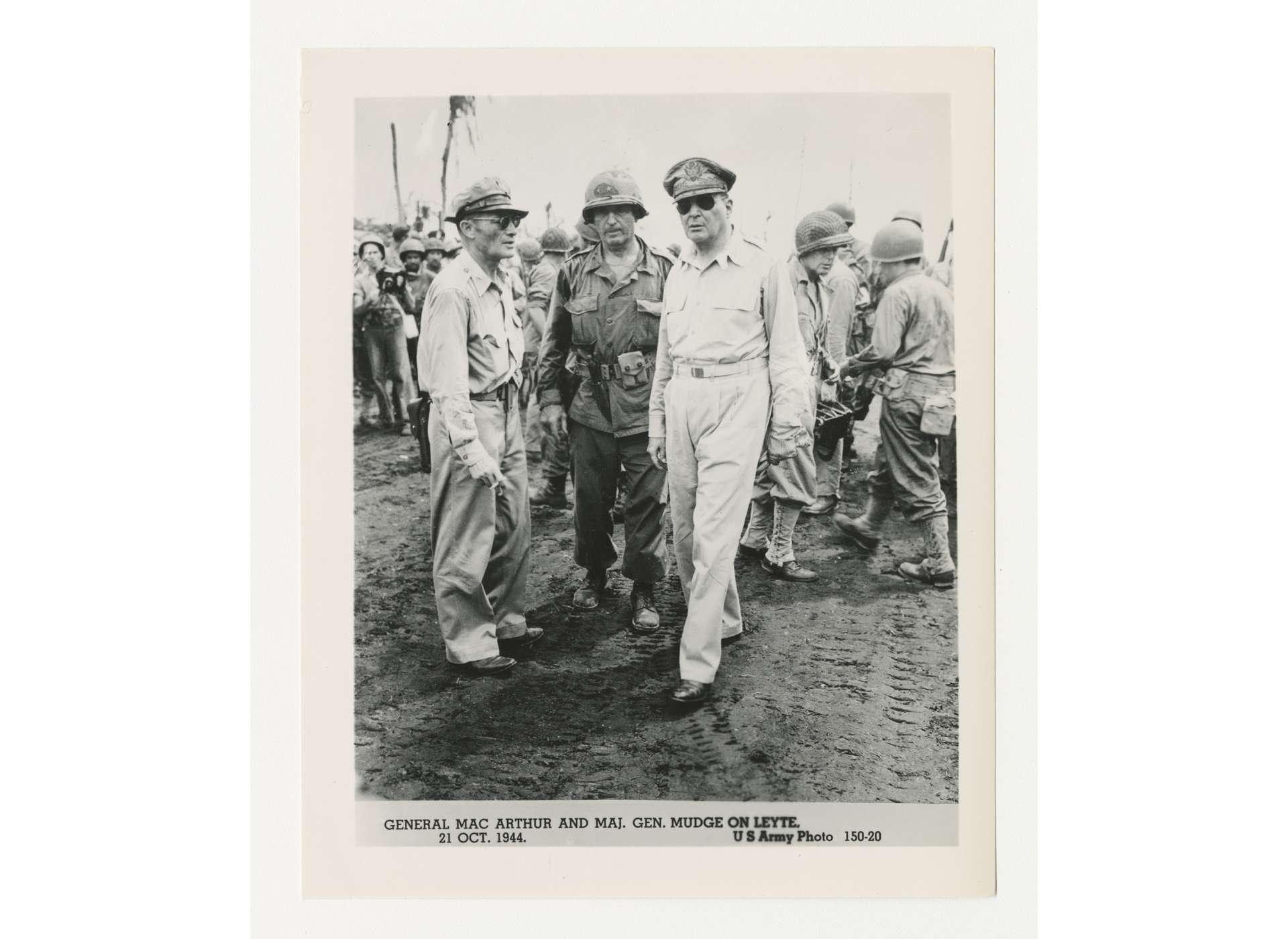 General Douglas MacArthur (right) conferring with Major General Verne C. Mudge (center), commanding general of the 1st Cavalry Division during the earlier Leyte campaign. On January 31, 1945, as the Cabanatuan raid was underway, MacArthur ordered Mudge to send his troopers to Manila and free the internees at Santo Tomas. US Army Photo, Gift of Lyle Eberspecher, from the Collection of The National World War II Museum, 2013.495.938.