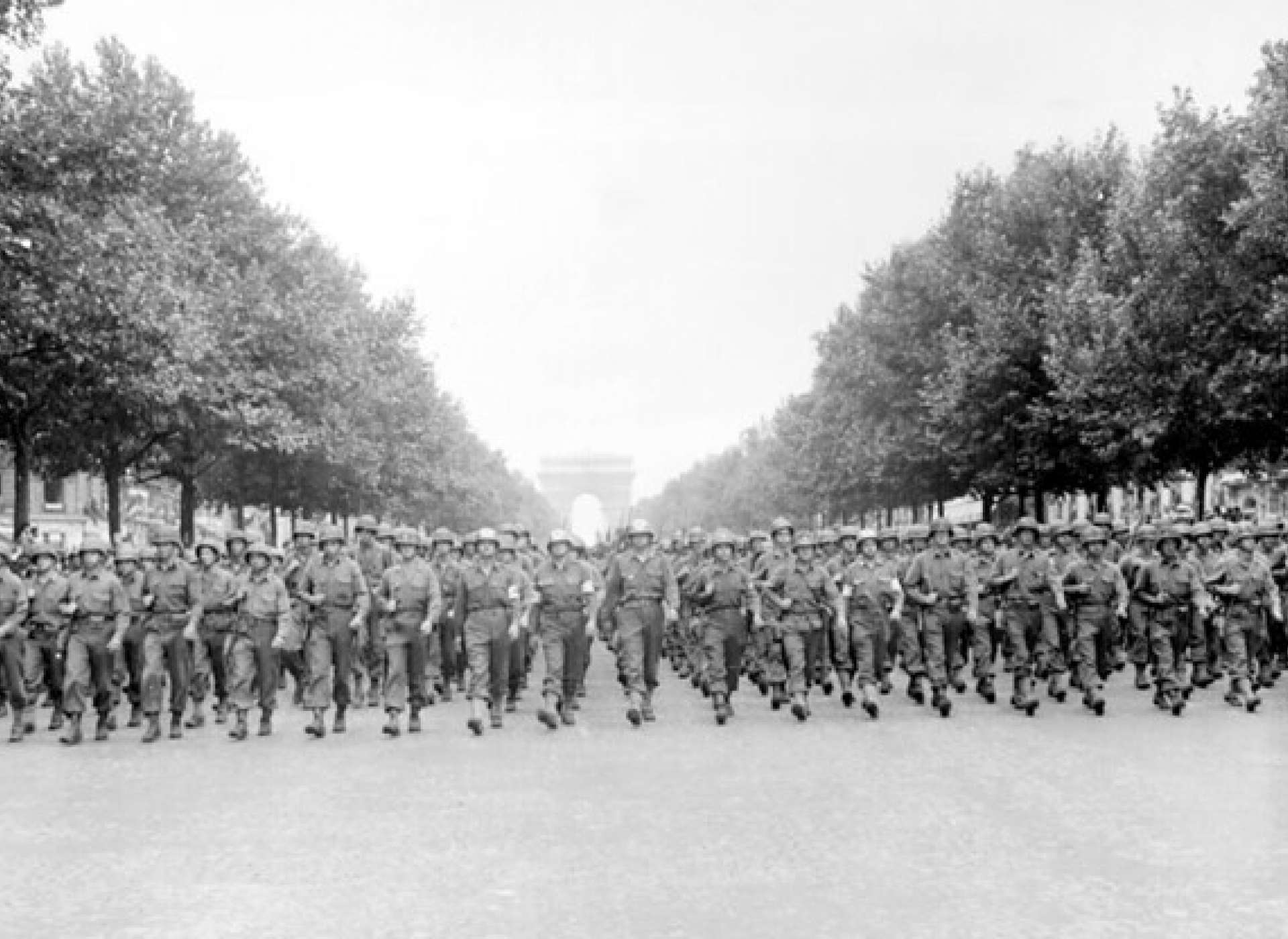 American troops of the 28th Infantry Division parade down the Champs-Élysées, Paris