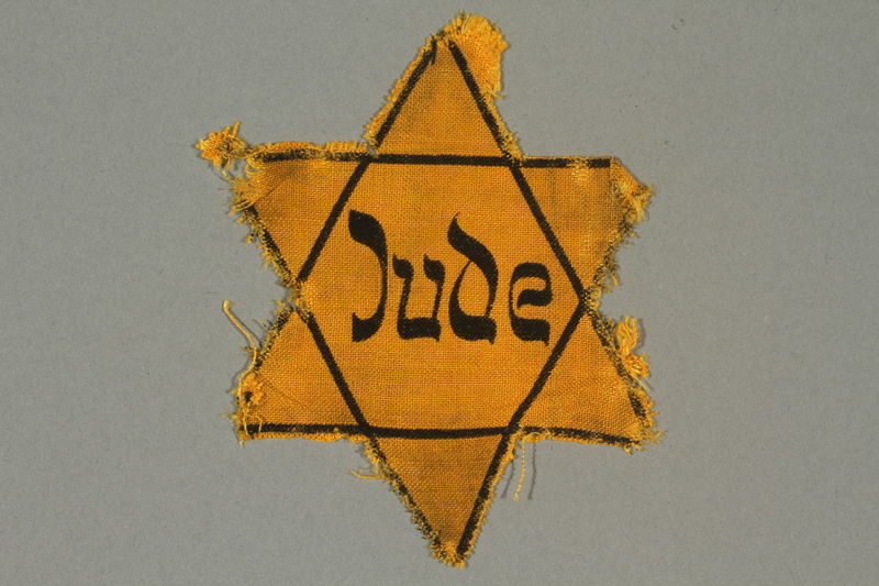 Star of David that Jews were required to sew onto their clothing as per the Nuremberg Laws.