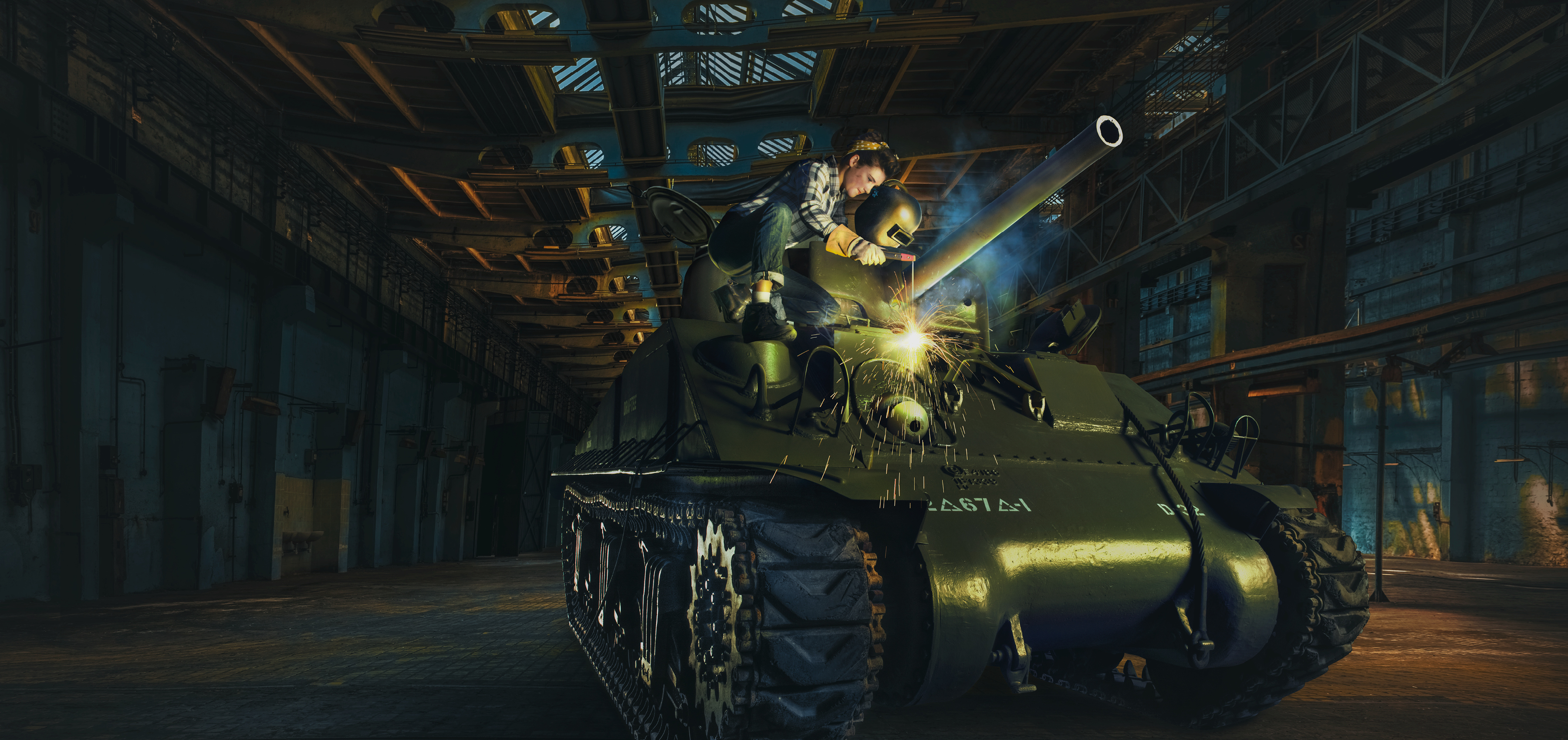 Woman working welding a tank 