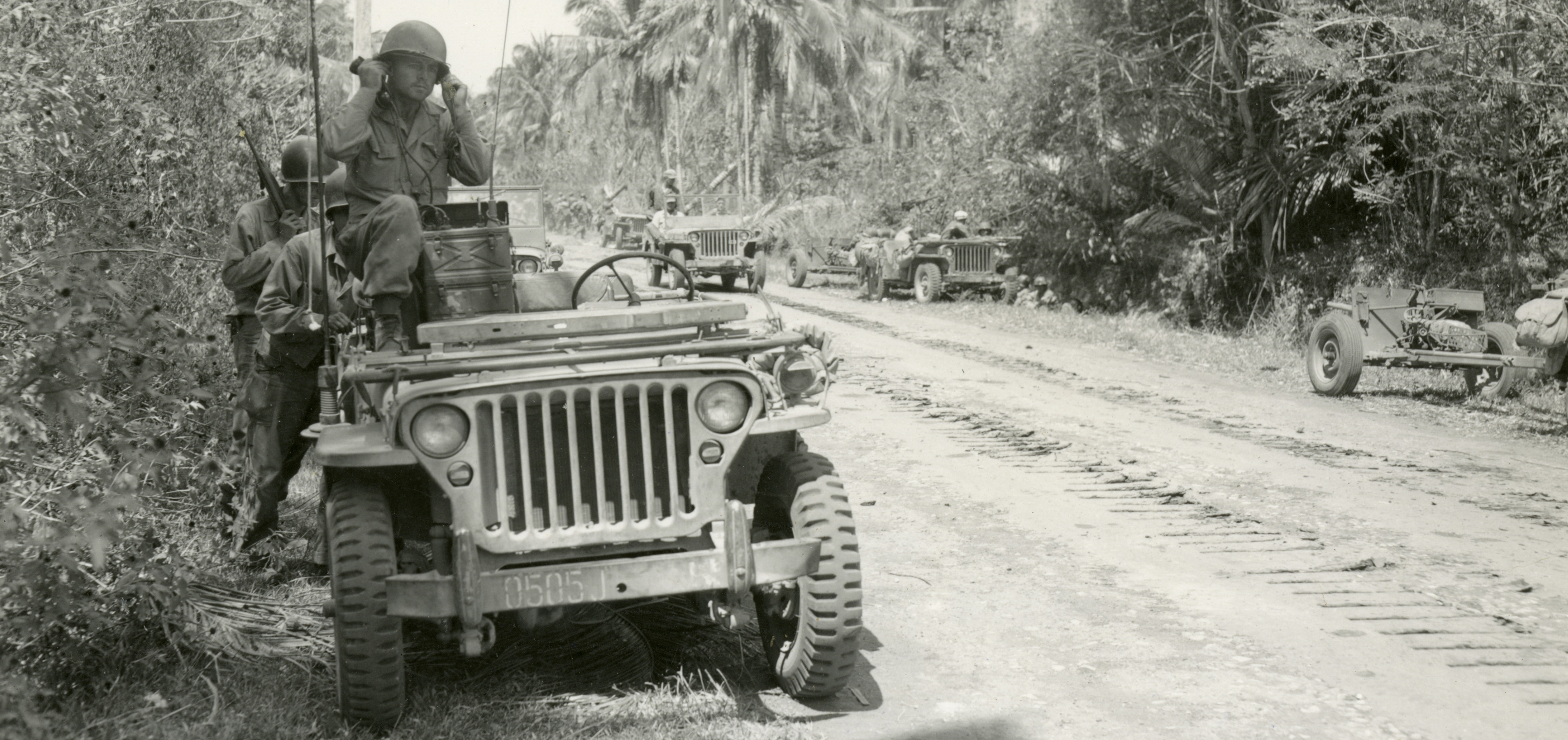 Soldier with radio in Jeep, Pacific theater