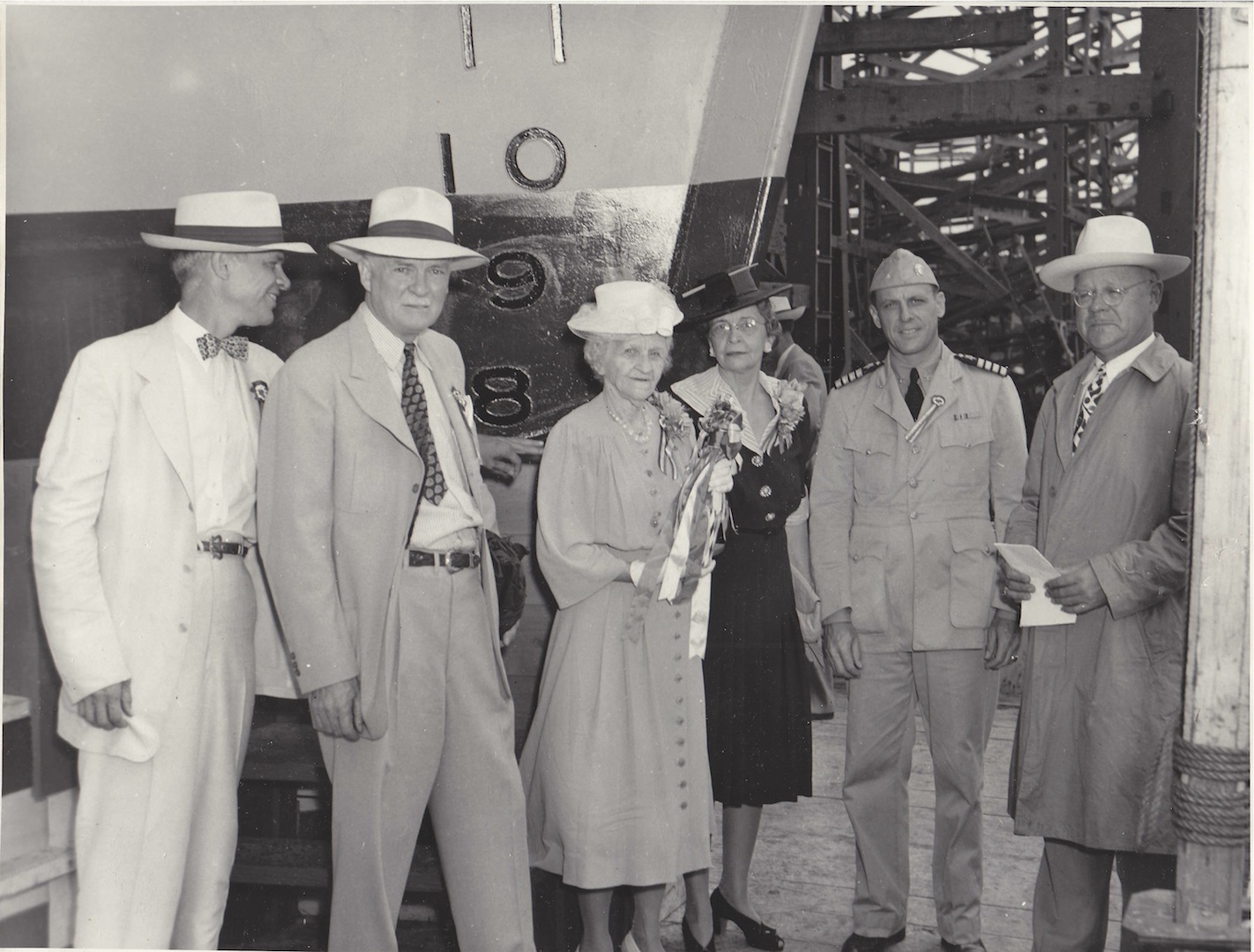 Guests prepare for Mrs. Brown to launch one of her sons' warships.