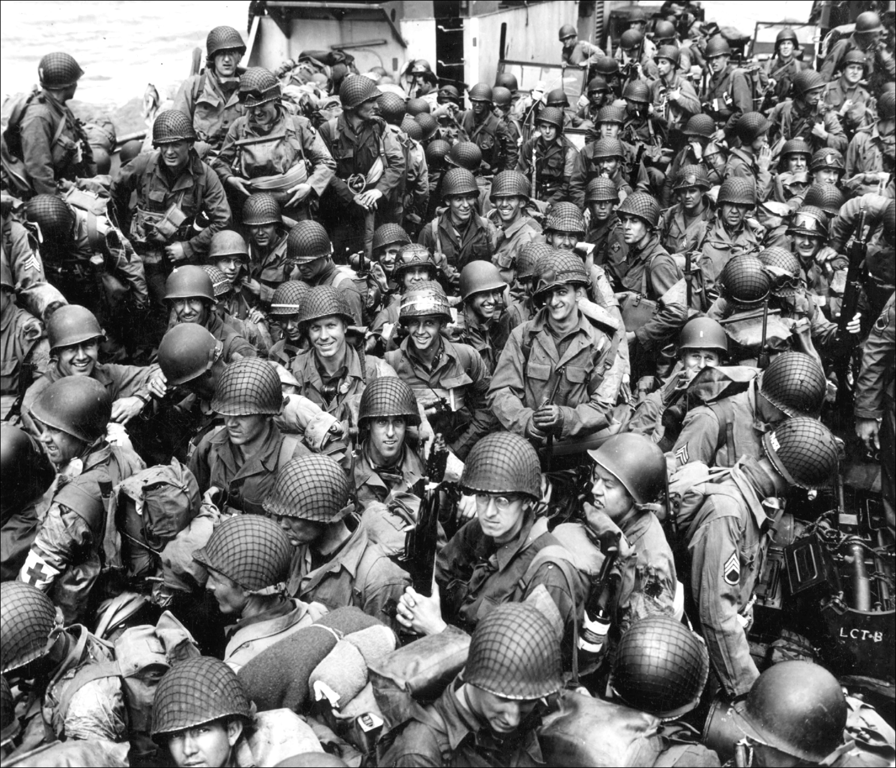 Soldiers packed on a boat during WWII