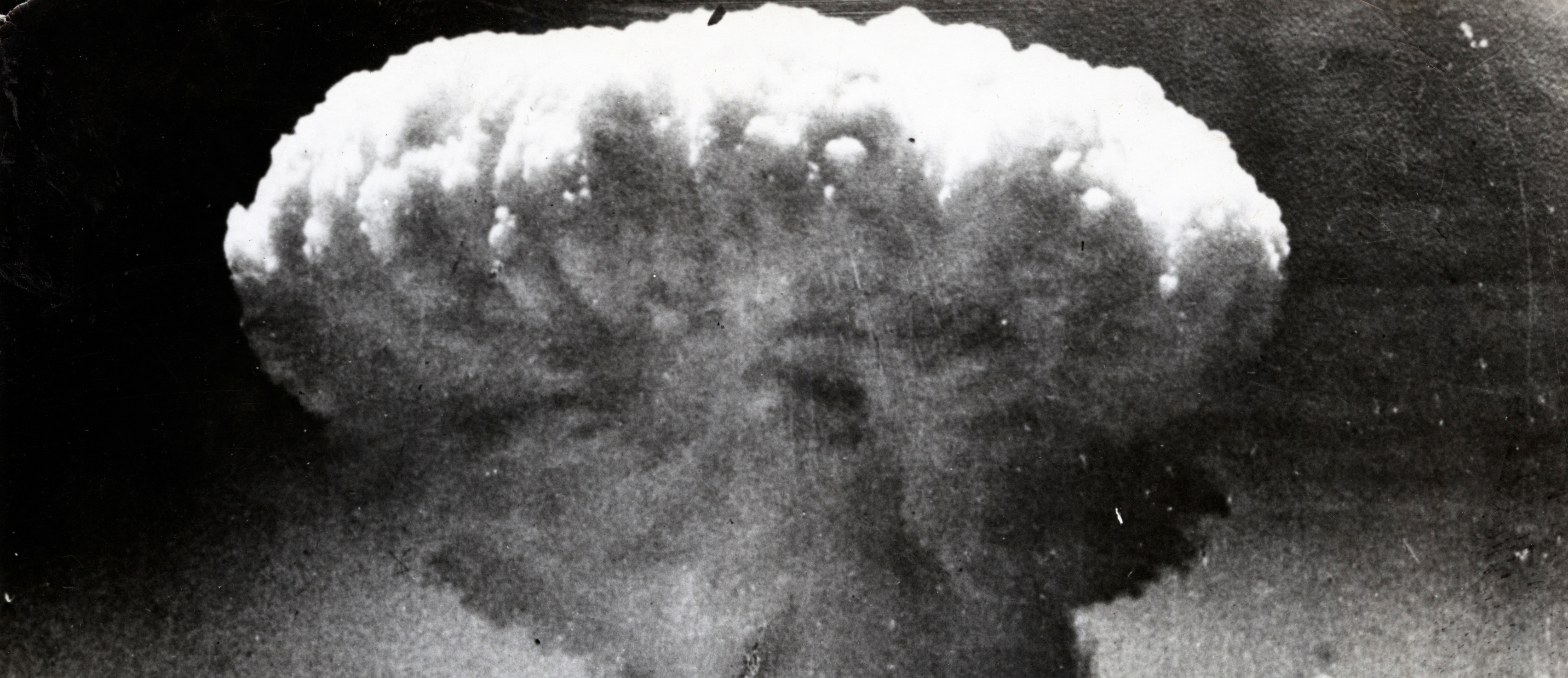 Mushroom cloud billows into the air after an atomic bomb was dropped on Hiroshima