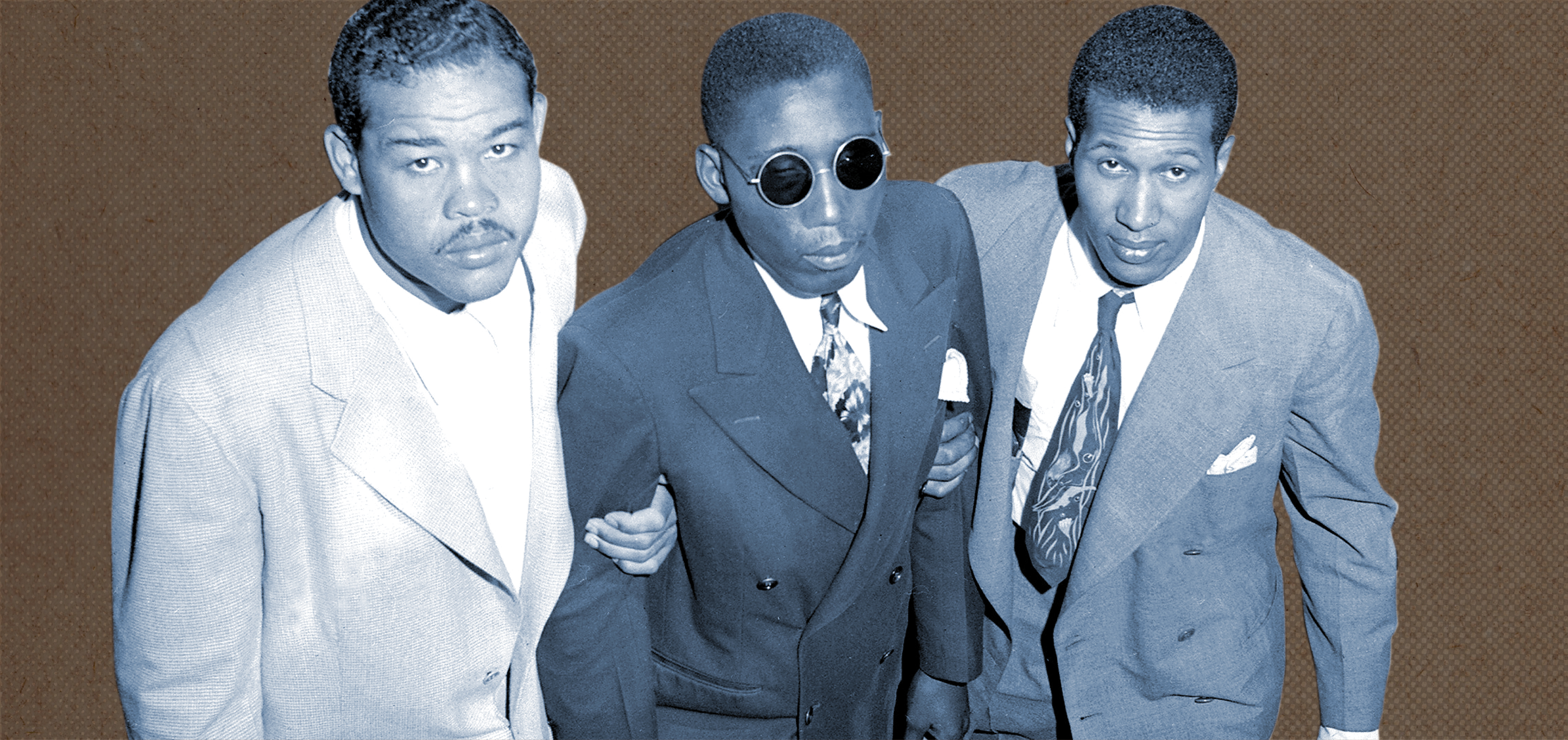 Sgt. Isaac Woodard, blind from a racially motivated beating, helped by two men