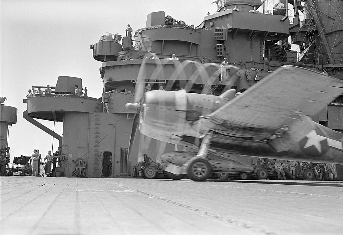 Airplane takes off from the deck of an aircraft carrier during WWII