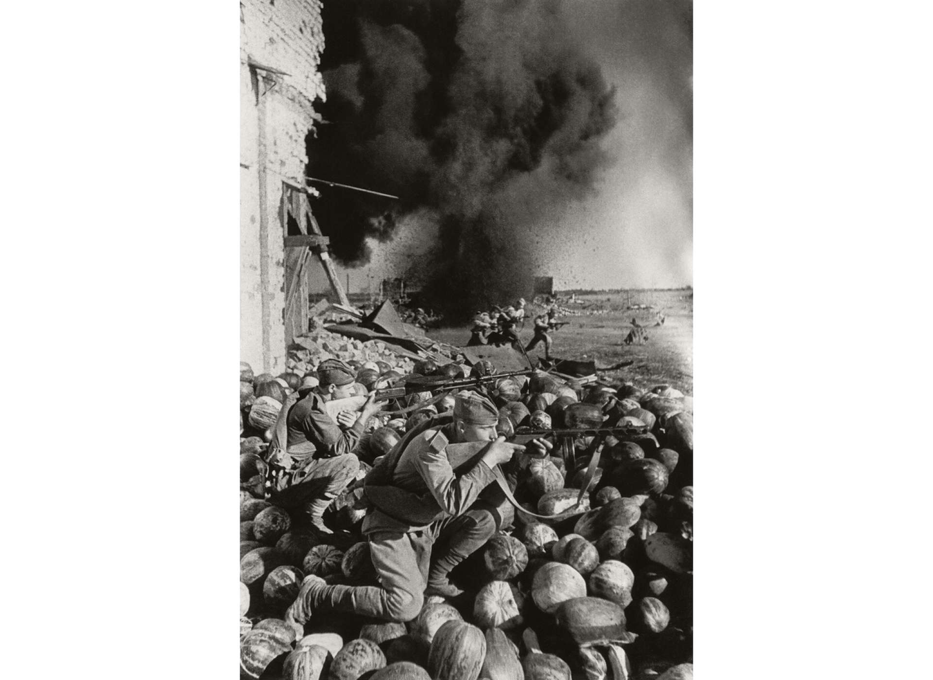 On the left, Soviet soldiers in combat in Stalingrad, Semen Fridliand, 1942.