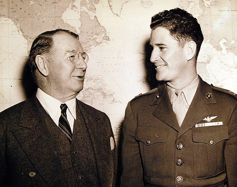 Secretary of the Navy, Frank Knox, congratulates Captain Joseph J. Foss, US Marine hero who downed 26 Japanese planes in the skies over Guadalcanal, National Museum of the US Navy.