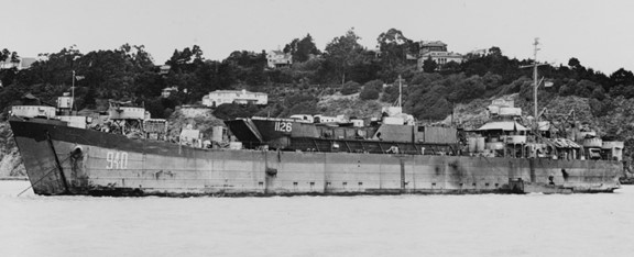 A Landing Ship Tank (LST) carries a Landing Craft Tank (LCT) topside.