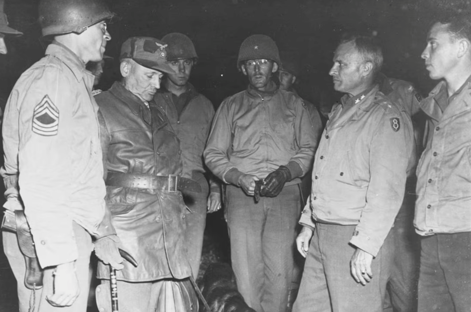 Army Maj. Gen. Donald A. Stroh receives the surrender of German Gen. Hermann Ramcke