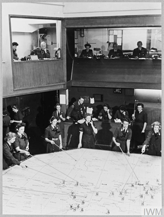 Women’s Auxiliary Air Force (WAAF) personnel move markers on the plotter map during the Battle of Britian. 