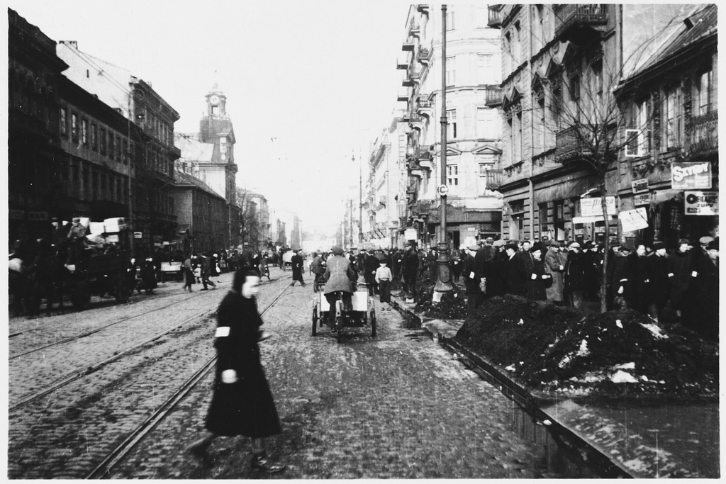 Jews walk along a crowded street in the Warsaw Ghetto, circa 1942.