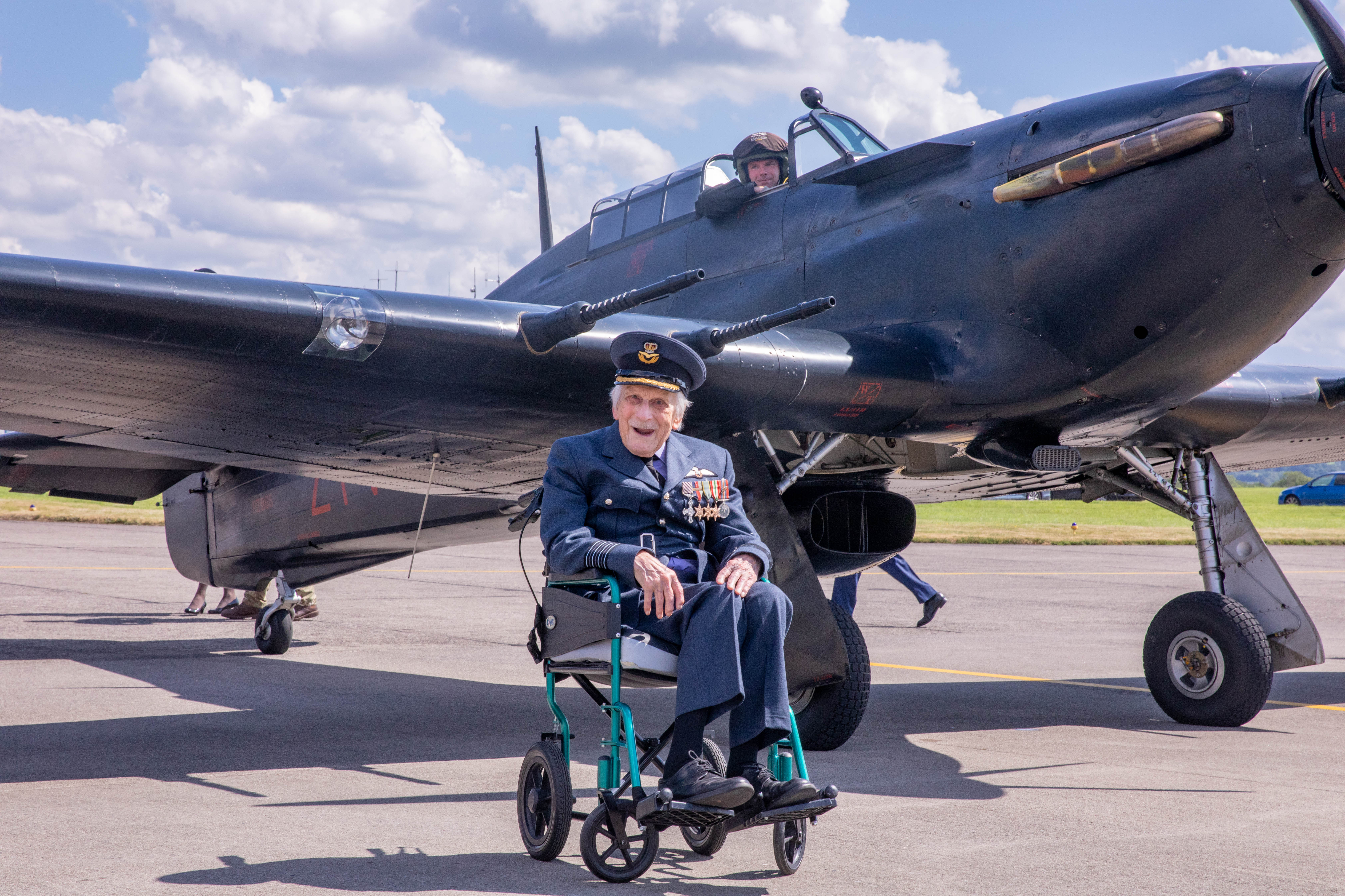 Group Captain John &quot;Paddy&quot; Hemingway in front of a Hawker Hurricane