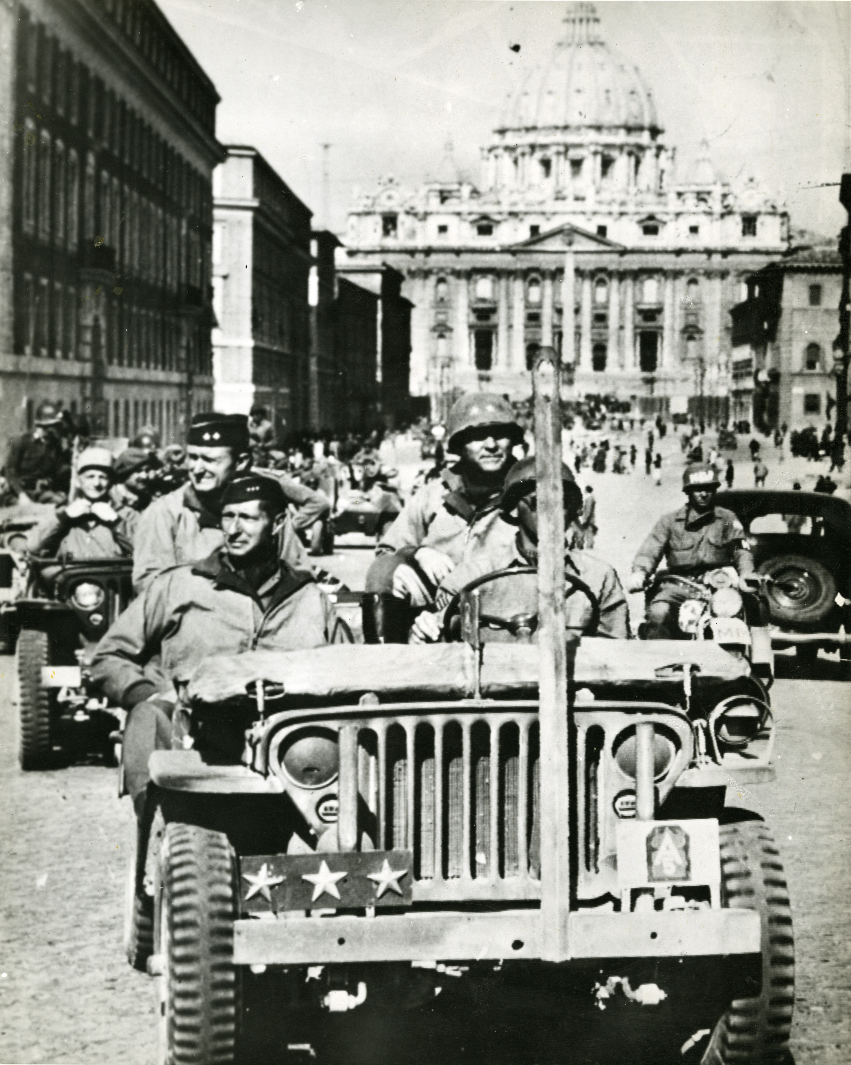 U.S. General Mark W. Clark riding in jeep on the Via della Conciliazione
