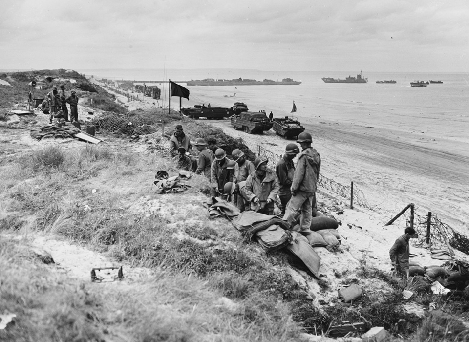 Navy Beach Battalion takes over a German bunker and slit trenches on a Normandy beach