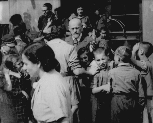 Janusz Korczak with children and teachers