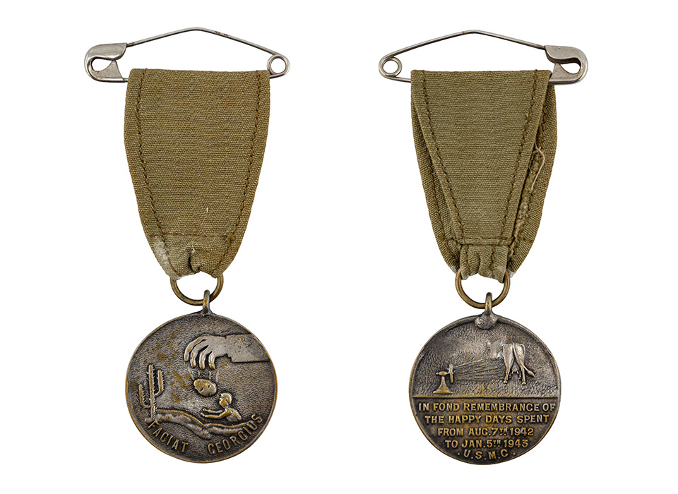 The front and back of the unofficial “George Medal,”