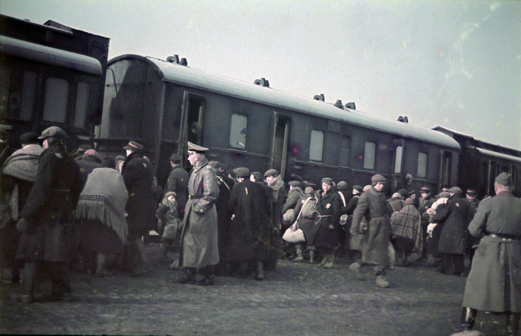 Jews board a passenger train during a deportation action in the Lodz ghetto