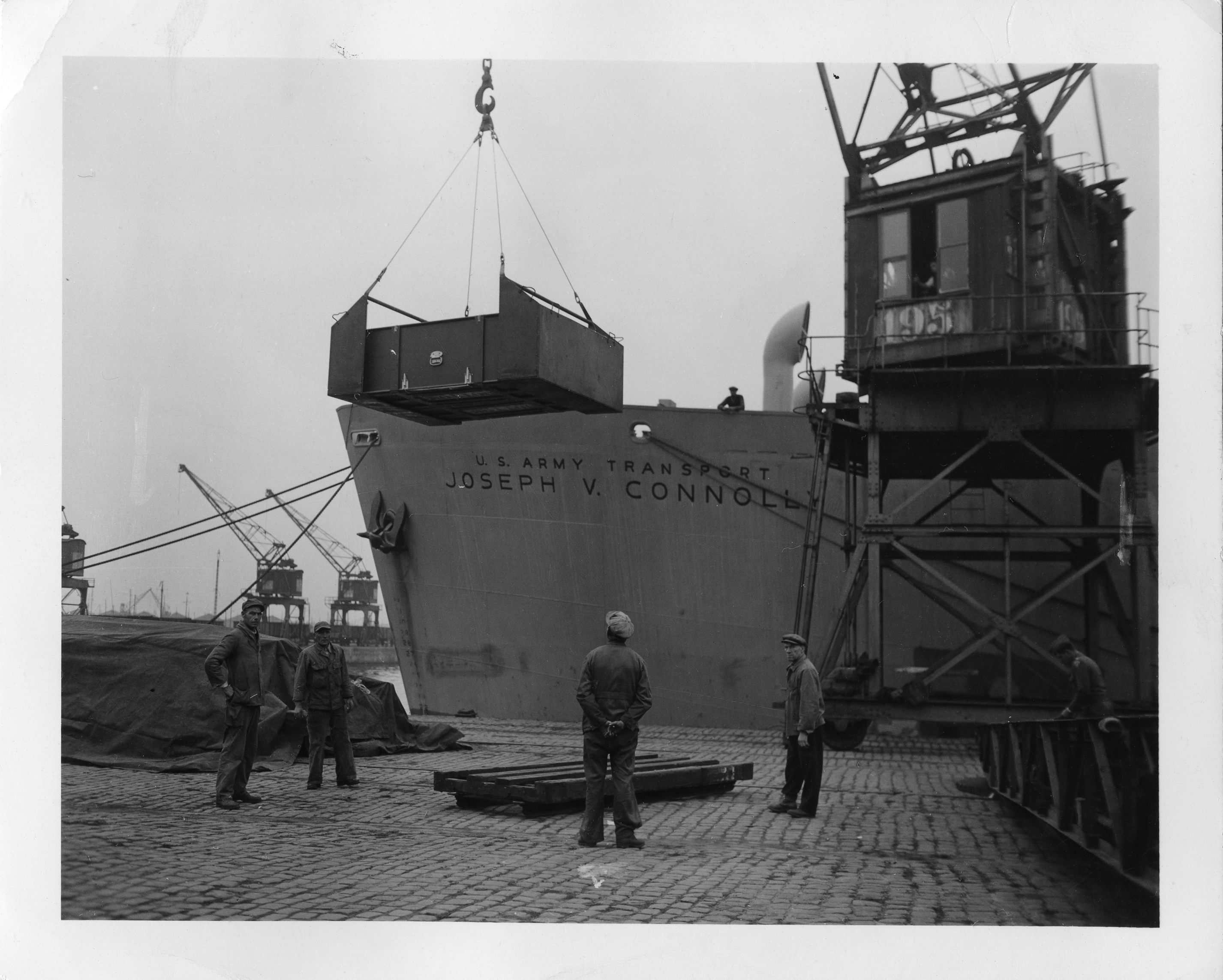 Caskets of American War Dead Are Shown as They Are Loaded Into Hold #1 of the USAT Joseph V. Connolly