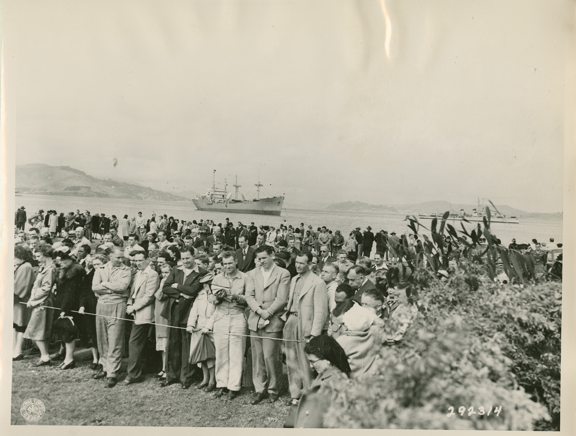 Crowd at a Ceremony for WWII Dead