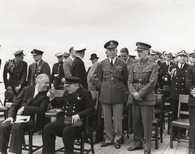 President Franklin Delano Roosevelt and British Prime Minister Winston Churchill meet aboard the HMS Prince of Wales during the Atlantic Conference