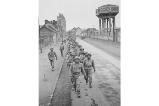 Black Volunteer infantry soldiers prepare for a day&#039;s training in preparation for shipment to veteran units at front lines in Germany. Courtesy National Archives and Research Administration, National Archives Identifier: 531357, Local Identifier: 111-SC-337901.