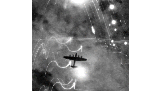 ghost army d day A Royal Air Force Lancaster bomber over Hamburg during Operation Gomorrah. Note the flares surrounding the bomber’s silhouette.