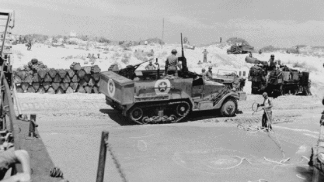 US forces coming ashore during Operation Husky in July 1943. This operation provided American forces the opportunity to develop tactics, techniques, and procedures that would be used in future assaults. (US Navy photo)