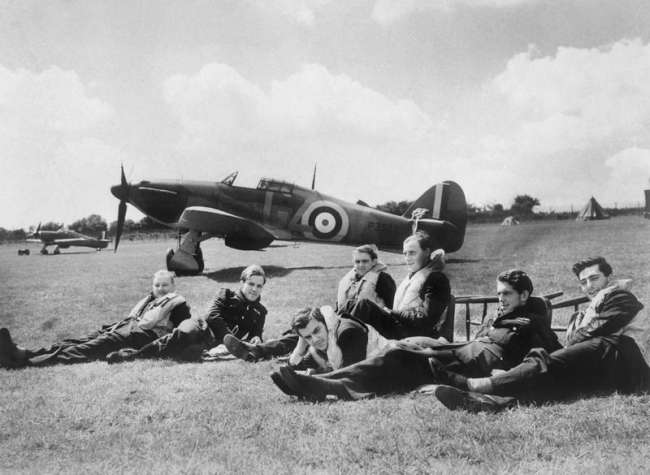 Royal Air Force (RAF) pilots during the Battle of Britain, with a Hawker Hurricane Mk I P3522 in the backdrop