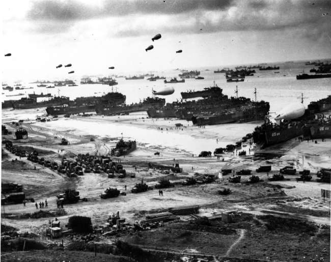 Landing ships putting cargo ashore on one of the invasion beaches