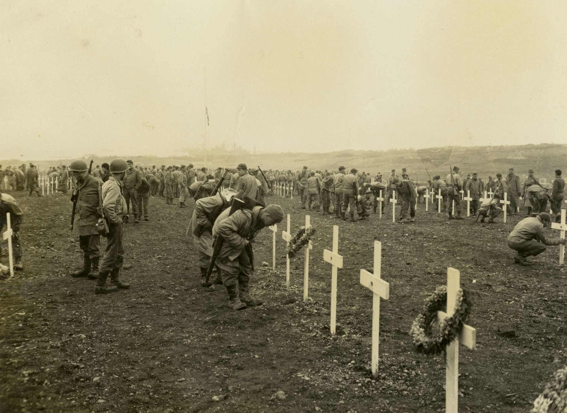 Soldiers viewing graves