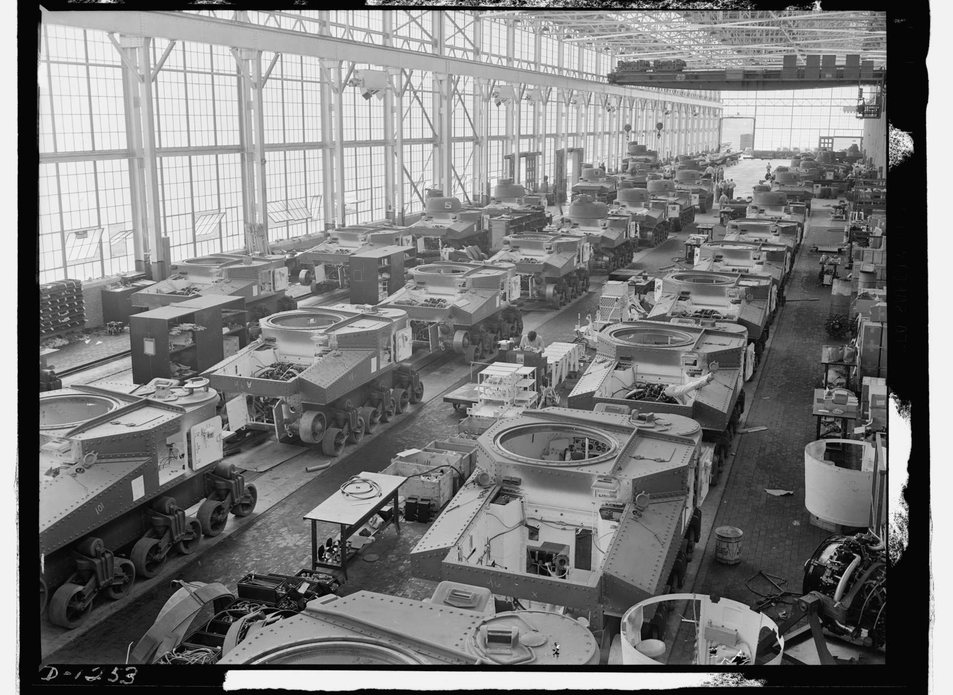 Tanks move along an assembly line that produced cars and trucks before the war at Chrysler in Detroit