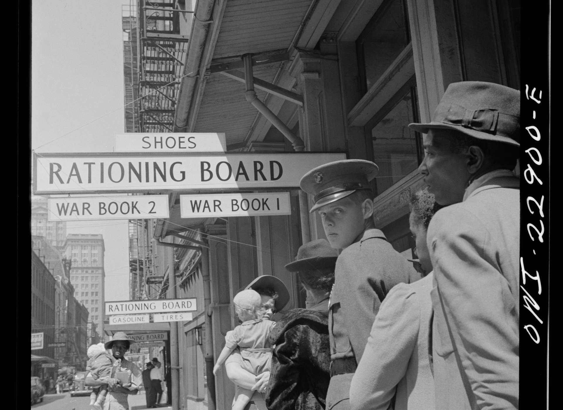 Citizens line up outside their local War Rationing Board office on Gravier Street in New Orleans, 1943.