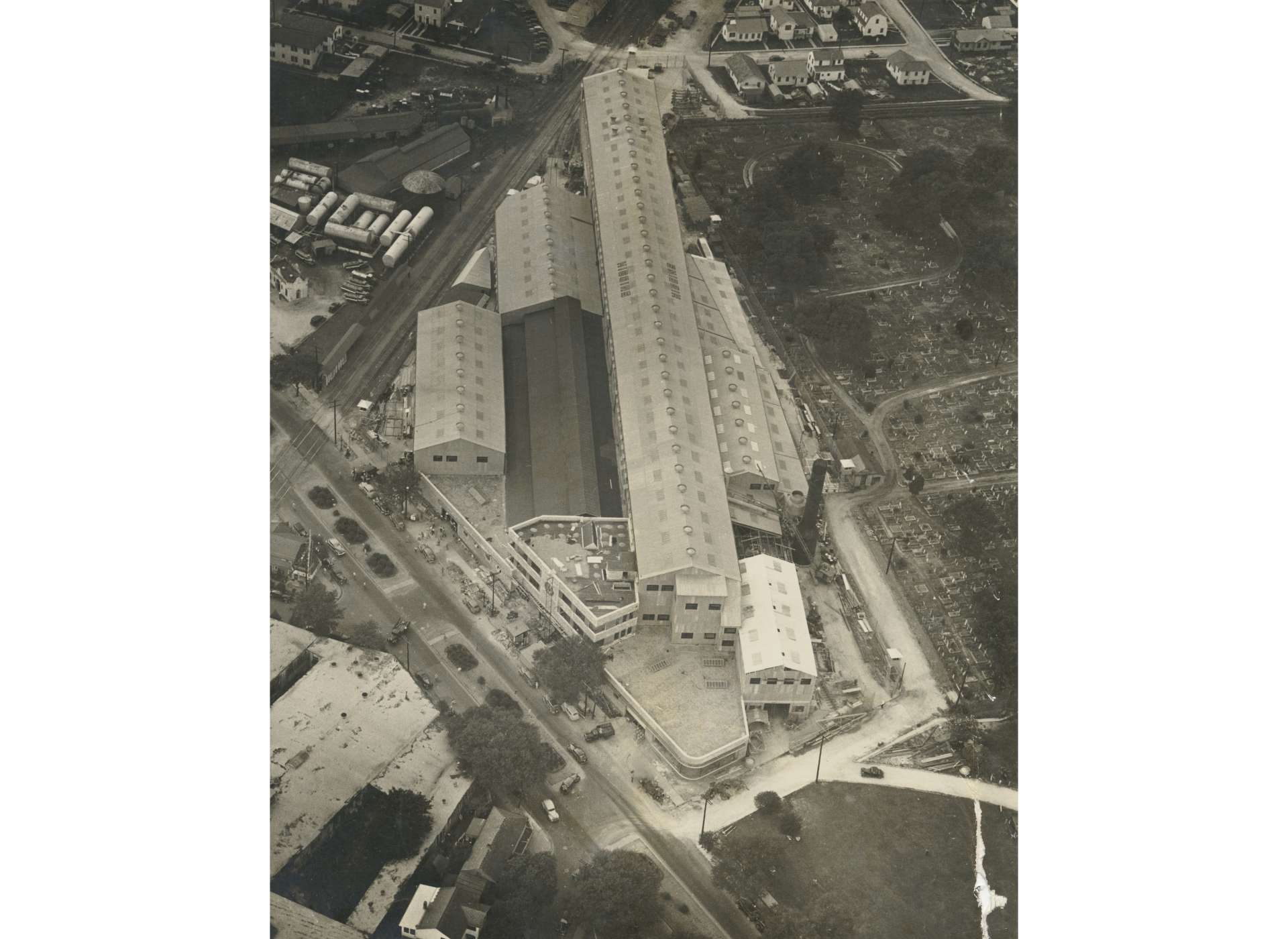 This May 1940 aerial photograph shows City Park Plant in the final stages of construction. When completed, City Park had one PT boat and two landing craft production lines. Higgins, without permission, built nearly 40 percent of the facility on property owned by Holt Cemetery. This property use was not resolved until after the end of World War II.