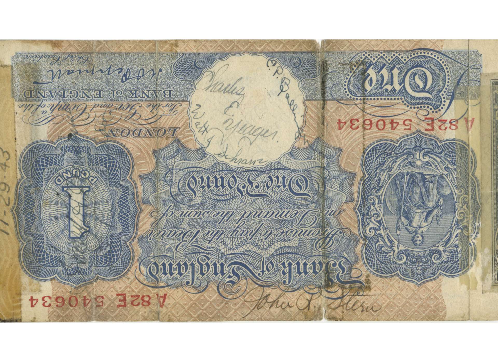 An English pound note with signatures of squadron members that was carried by Captain Charles K. Peters. Lieutenant Charles Yeager&#039;s signature is featured prominently in the middle.