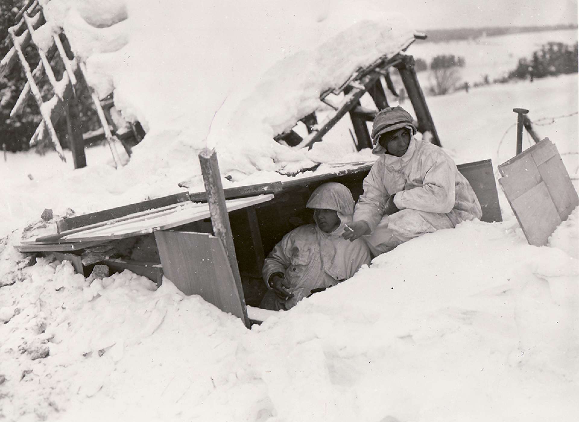 2nd Division, 9th Regt soldiers in foxhole near Bullingen, Belgium. The National WWII Museum Digital Collections.