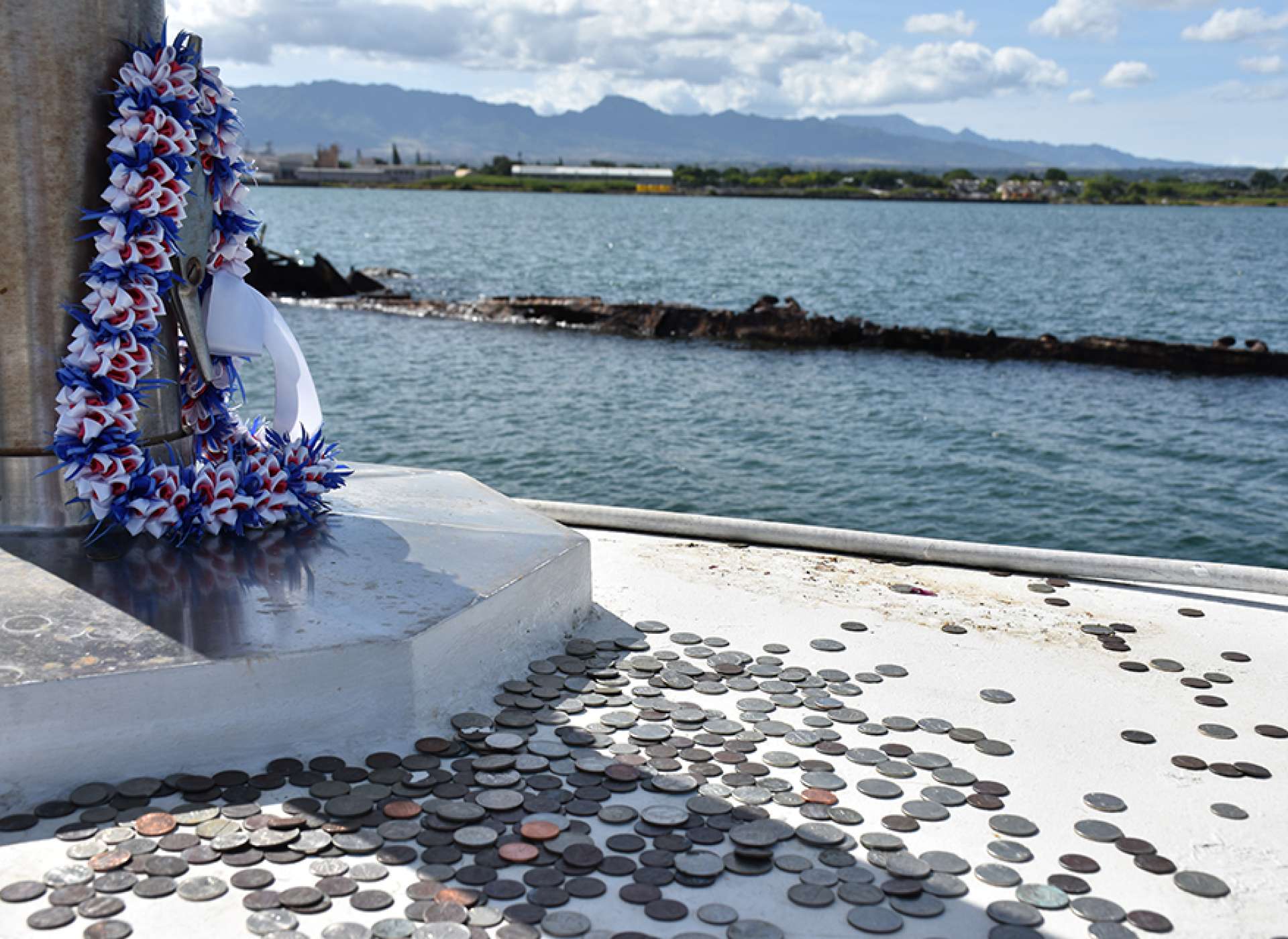 Coins and flowers at the USS Utah memorial on Ford Island, Pearl Harbor, Hawaii. Credit: Keith Huxen, PhD