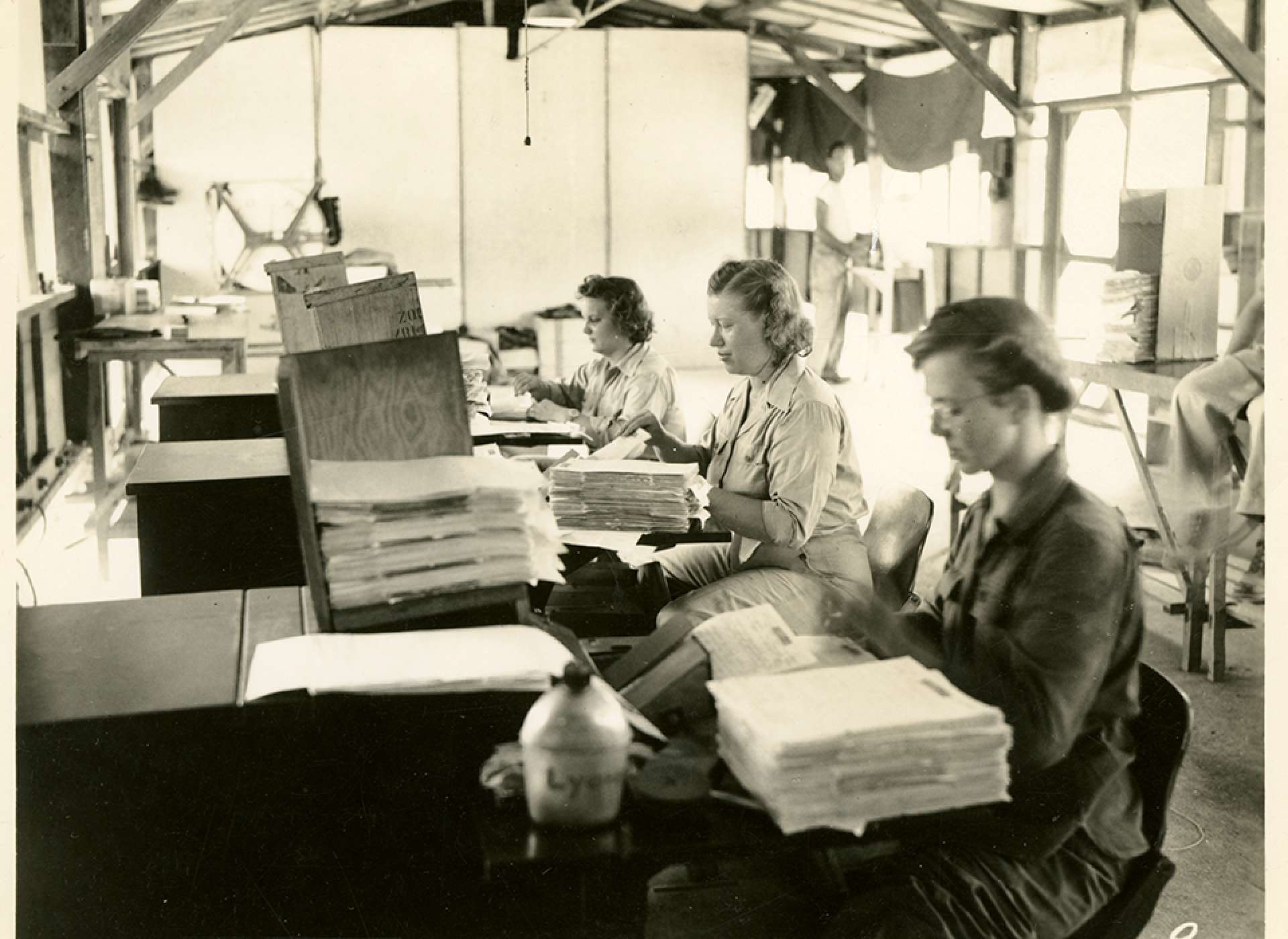V-mail operation in the field at APO 929.”The recording operation, using the Recordak machines. These operators photograph approximately seventeen hundred letters on each 100 foot roll of film, and can be done in about three quarters of an hour.” Port Moresby, Papua New Guinea. 1944