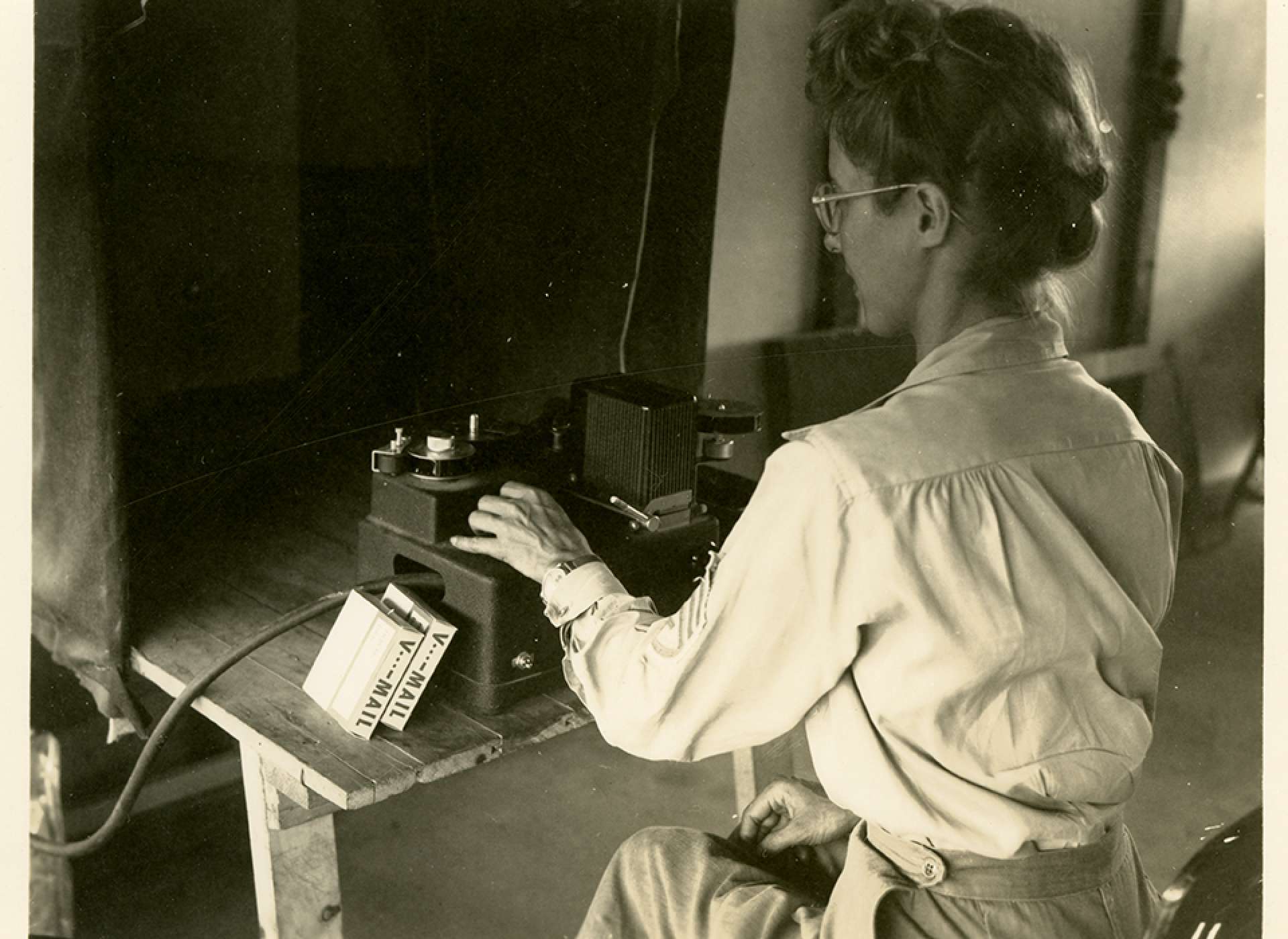 V-mail operation in the field at APO 929.”After processing the film is taken to inspection where it is carefully examined on a projection machine, for any flaws which may have occurred either during the recording or in developing. These bad letters are then punched out and tallied, so they can be re-photographed on a later roll.”