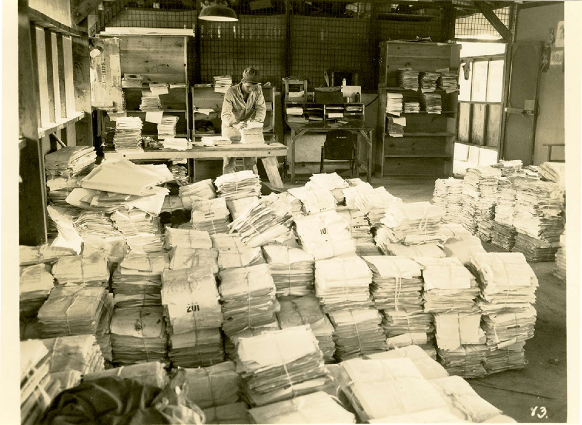 V-mail operation in the field at APO 929.&quot;The retake department where all originals of V-Mail are stored until destruction orders are issued by the States. Destruction orders are not issued until the States stations have satisfactorily reproduced every letter on a roll. Should the States advise that certain letters must be rephotographed, the proper bundle must be located and the letter withdrawn to be recorded again.