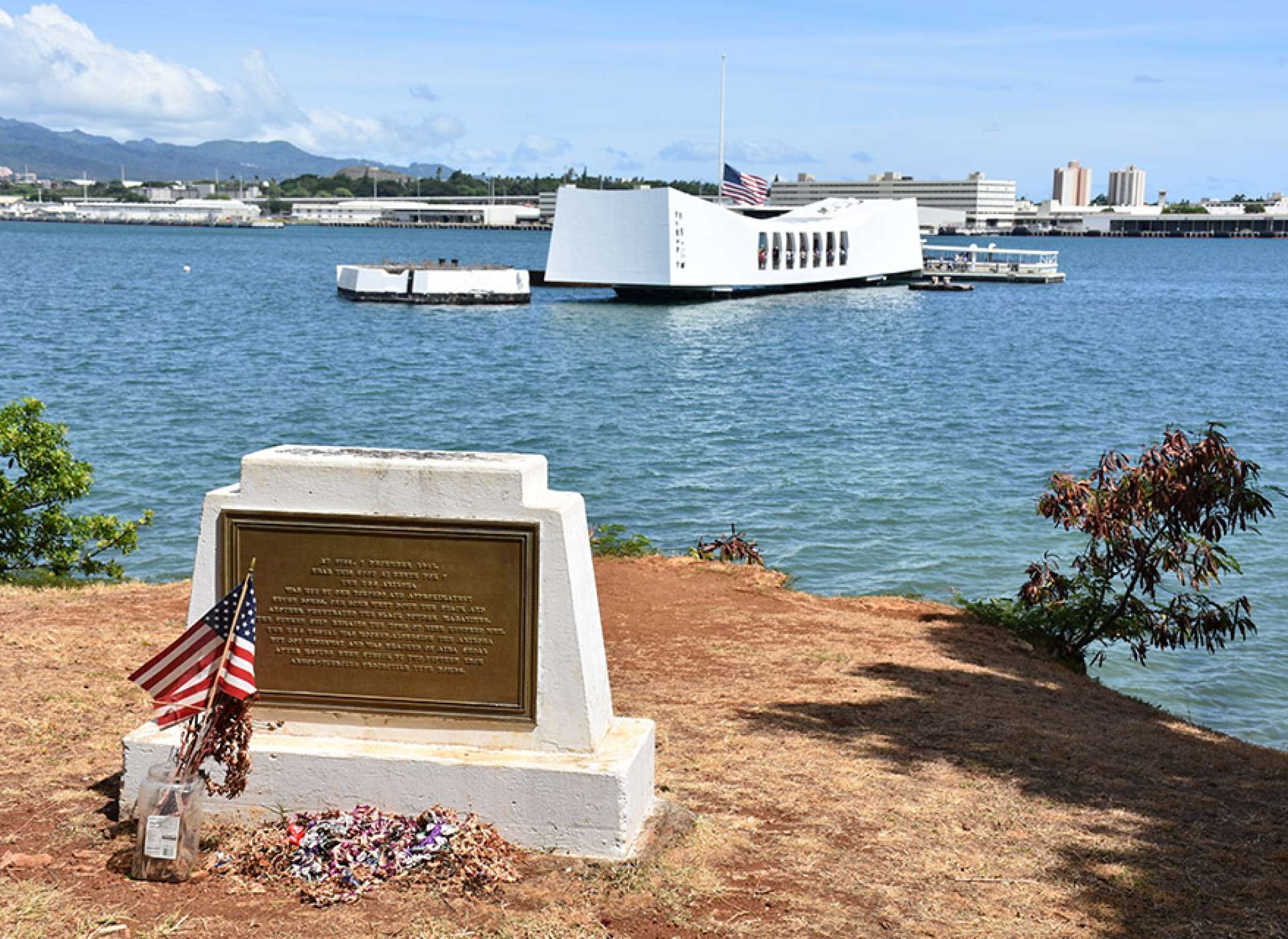 Coins atop the USS Arizona memorial on Ford Island, Pearl Harbor, Hawaii. Credit: Keith Huxen, PhD