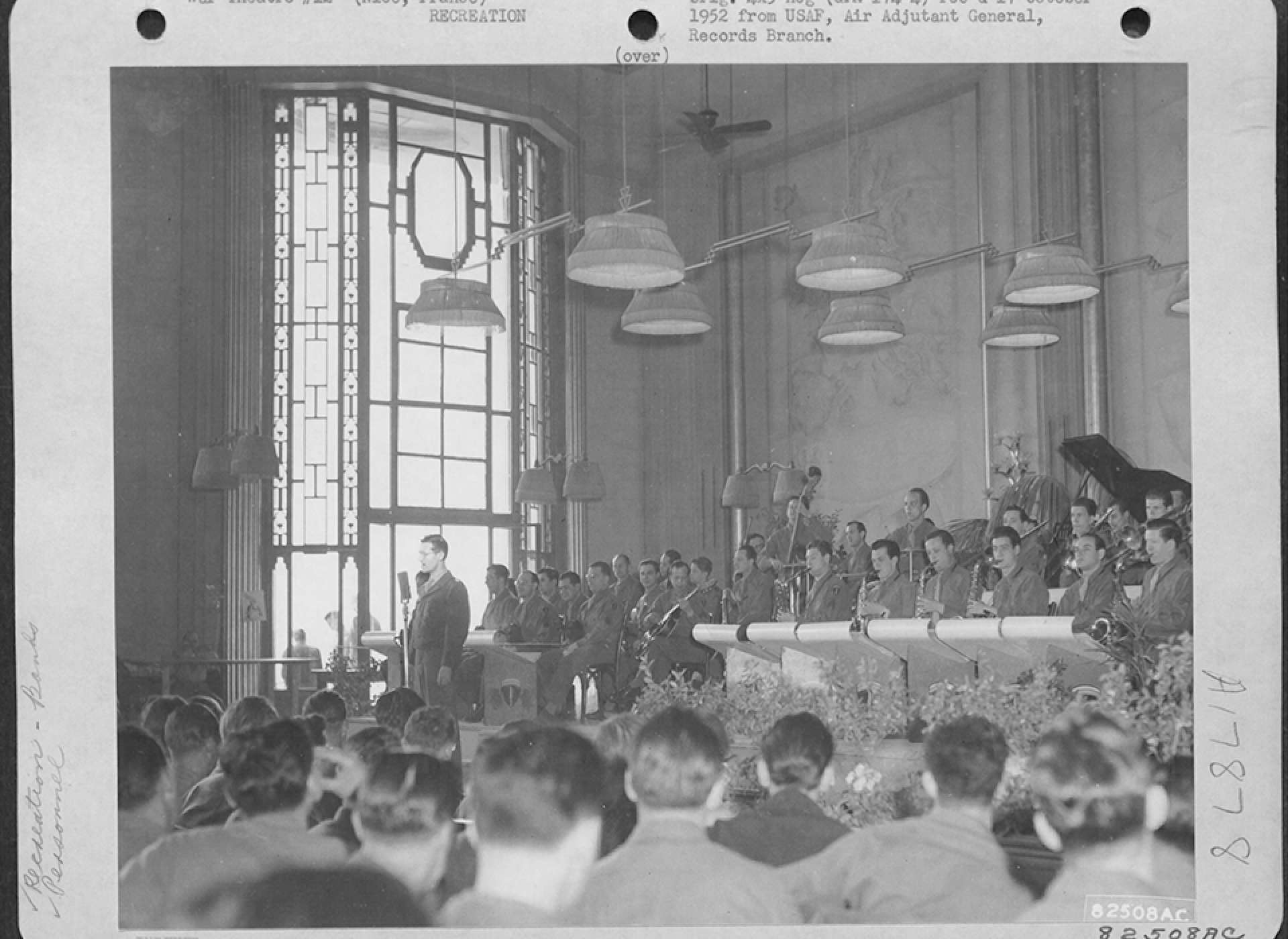 The Army Air Forces Band, directed by Ray MacKinley after Miller’s disappearance, plays for GIs on leave in Nice, France, May 1945. US Air Force photograph.