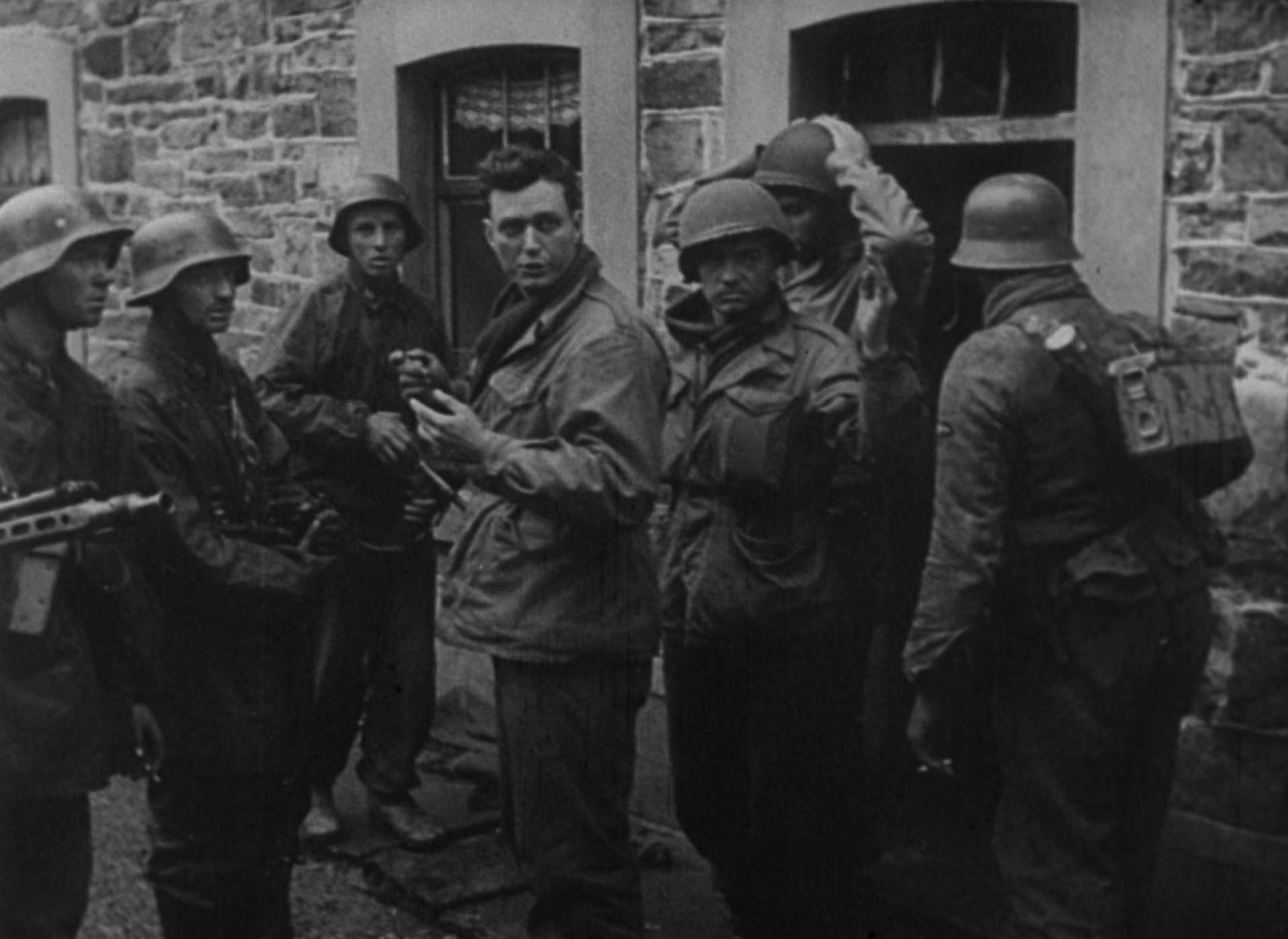 Americans come out of their defensive positions and surrender to Panzergrenadiers in Stoumont.